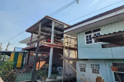 a house being built with scaffolding around it at Lilliput Riverside Bangkachao in Samutprakarn
