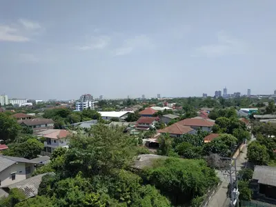 a view of a city with houses and trees at JVAPLACE in Nonthaburi