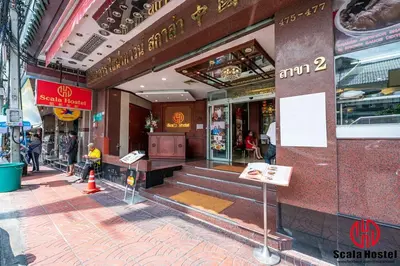 a building with steps in front of a store at Scala Hostel in Bangkok