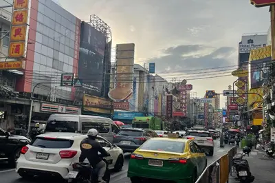a busy city street filled with lots of traffic at Scala Hostel in Bangkok
