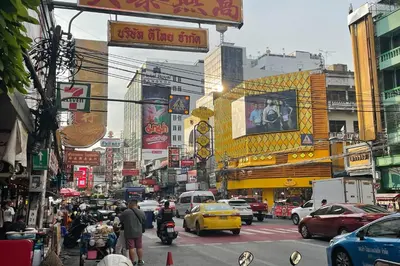 a busy city street filled with lots of traffic at Scala Hostel in Bangkok