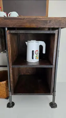 a tea pot sitting on a shelf in a cabinet at J.K. Mansion in Bangkok