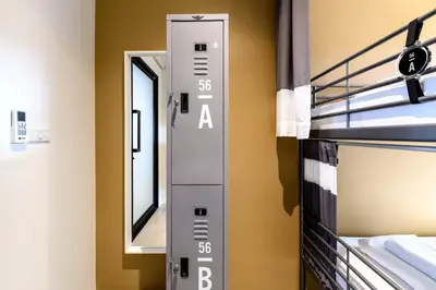 a elevator in a room with bunk beds at Stay Wanglang in Bangkok