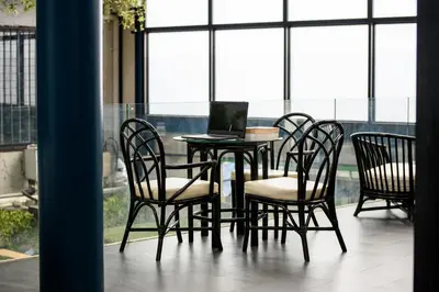 a table and chairs with a laptop on it at Stay Wanglang in Bangkok