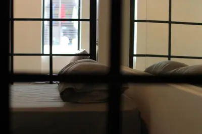 a view of a room with two windows and a couch at Baan33 check in by yourself code inbox 4fl behind Amazon cafe in Bangkok