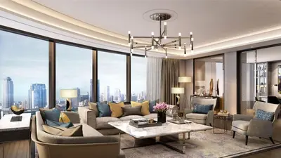 a living room with a couch and a table at InterContinental Bangkok by IHG in Bangkok