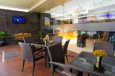 a dining room with a table and chairs in a store at iCheck inn Nana by Aspira in Bangkok