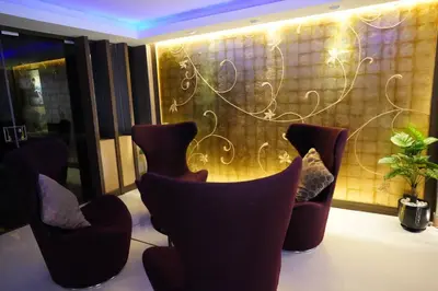 a room with chairs in front of a window at iCheck inn Nana by Aspira in Bangkok