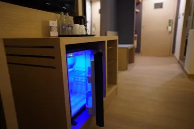 a video game console sitting under a counter at iCheck inn Nana by Aspira in Bangkok