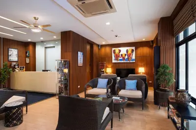 a waiting area with chairs and a waiting room at iCheck inn Gems Center Silom in Bangkok