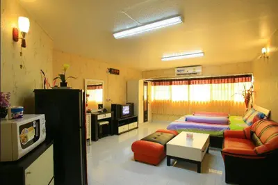a large living room with a couch and a bed at Deluxe at Popular Condo in Bangkok