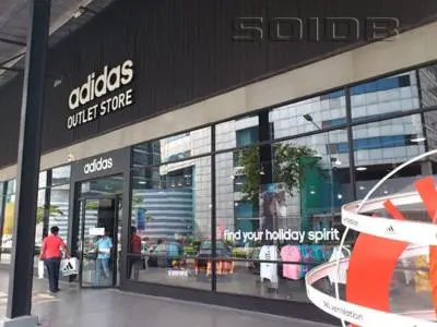 a store front of a store with people walking outside at Deluxe at Popular Condo in Bangkok