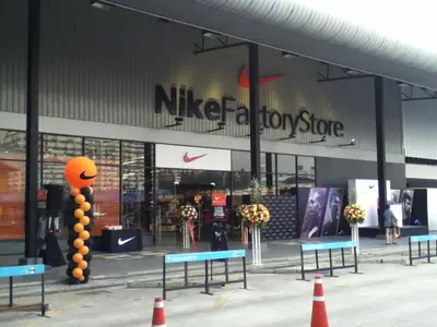 a nike station store with benches in front of it at Deluxe at Popular Condo in Bangkok
