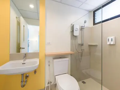 a bathroom with a toilet and a sink and a shower at HOP INN Chaengwattana in Nonthaburi