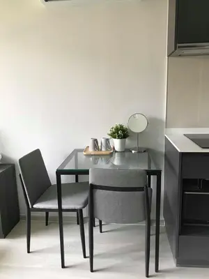 a dining room table with two chairs and a mirror at CBD Asoke/Nana/Ploenchit +2 mins to Terminal 21 in Bangkok
