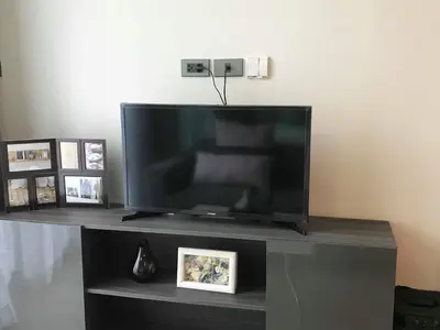 a large flat screen tv sitting on a entertainment center at CBD Asoke/Nana/Ploenchit +2 mins to Terminal 21 in Bangkok