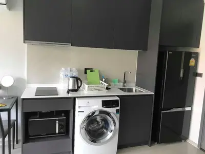 a kitchen with a washing machine and a sink at CBD Asoke/Nana/Ploenchit +2 mins to Terminal 21 in Bangkok