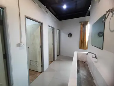 a bathroom with a sink and a bath tub at Baan1668 Hometel near Chinatown One Bangkok in Bangkok