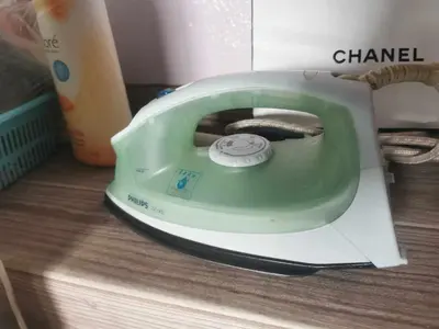 a green toaster sitting on top of a table at Baan1668 Hometel near Chinatown One Bangkok in Bangkok