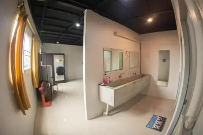 a bathroom with a sink and a mirror at Baan1668 Hometel near Chinatown One Bangkok in Bangkok