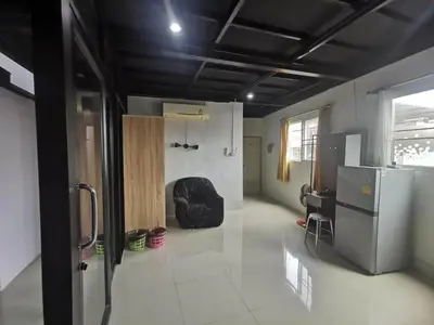 a kitchen with a black ceiling and a refrigerator at Baan1668 Hometel near Chinatown One Bangkok in Bangkok