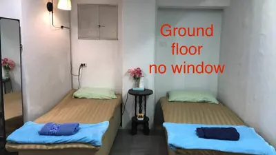 a room with two beds and a sign that reads ground floor no window at Baan1668 Hometel near Chinatown One Bangkok in Bangkok