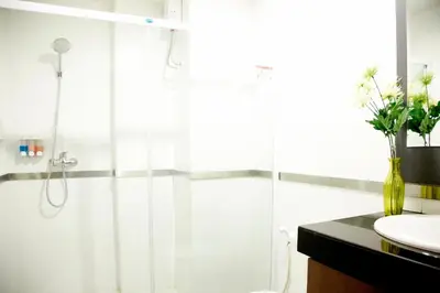 a bathroom with a shower and a sink at Poste 43 Residence in Bangkok