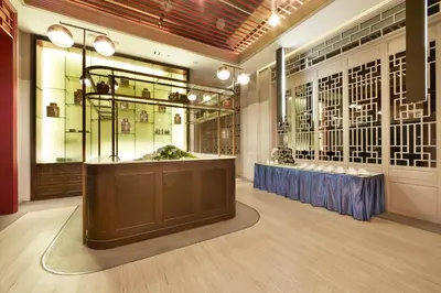 a room with a display case in a store at The Quarter Hualamphong by UHG in Bangkok