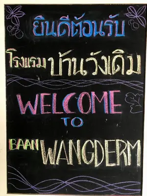 a chalkboard with the words welcome toiane warbringer at Baan Wangderm Hotel in Bangkok