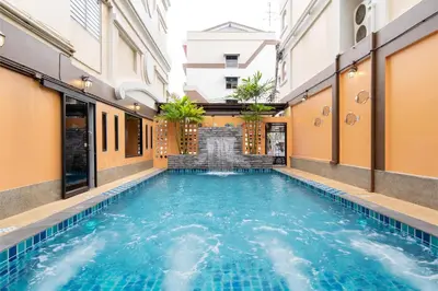 a swimming pool in the middle of a building at P-Park Hotel Bangkok in Bangkok
