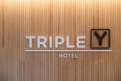 a door with the words triple hotel on it at Triple Y Hotel in Bangkok