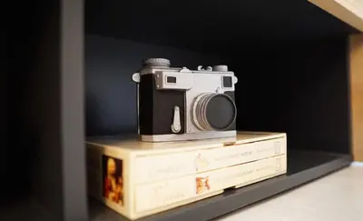 a camera sitting on top of two books at INN Room in Bangkok
