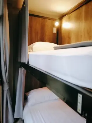 a couple of bunk beds in a room at White House Hostel in Bangkok