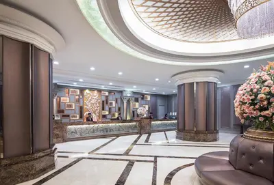 a lobby of a hotel with a large ceiling at The Berkeley Hotel Pratunam in Bangkok