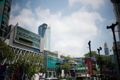 a city with tall buildings and a street with cars at The Berkeley Hotel Pratunam in Bangkok