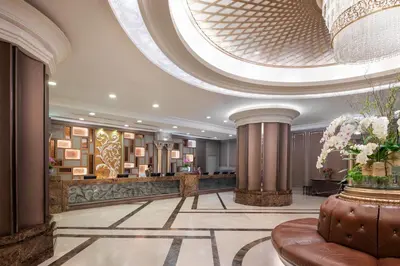 a lobby of a hotel with a large ceiling at The Berkeley Hotel Pratunam in Bangkok