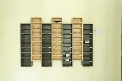 a row of lockers on a wall at BeWish Residence Bangphlat in Bangkok