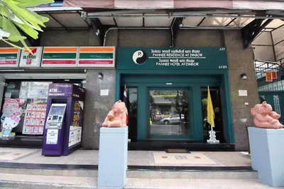 a store front of a store with two large pink pig statues at Super OYO 483 Pannee Hotel Khaosan in Bangkok