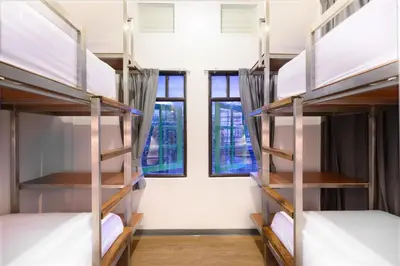 a room with bunk beds in a dorm room at REST IS MORE hostel in Bangkok