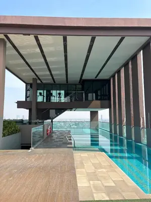 a view of a building with a swimming pool at The Gallery condominium in Samut Prakan