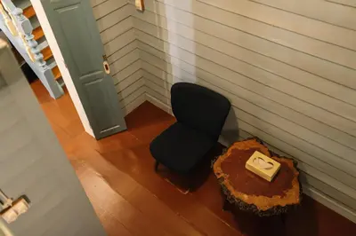 an overhead view of a chair and a table with a box at Lhong Yaowarat hostel in Bangkok