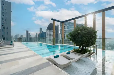 a swimming pool on the roof of a building at Staybridge Suites Bangkok Thonglor by IHG in Bangkok