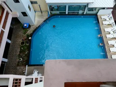 an overhead view of a large swimming pool in a building at MANGO Lagoon Place in Bangkok