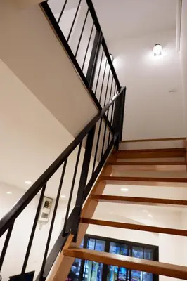 a staircase in a building with a window at Lisa'House in Bangkok