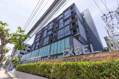 a building with a sign that reads the excel crore at The Excel Groove Condo at Lasalle 52 in Bangkok
