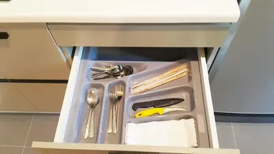 a drawer in a table with utensils in it at The Excel Groove Condo at Lasalle 52 in Bangkok