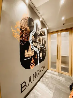 a room with a large sign on the wall at YAKTHAI POSHTEL in Bangkok