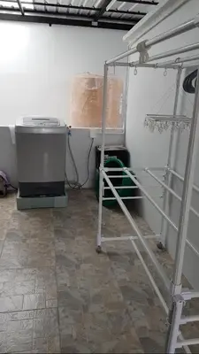 a room with a heater and a shelf in a room at Cozy Studio 1 in Sathorn, BTS Saint Louis in Bangkok