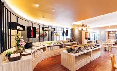 a kitchen with a counter with some food on it at Baron Residence Bangkok in Bangkok