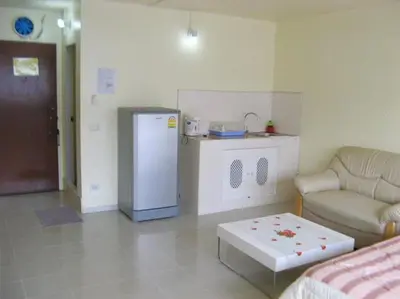 a living room with a refrigerator and a couch at SK Muang Thong Thani in Bangkok